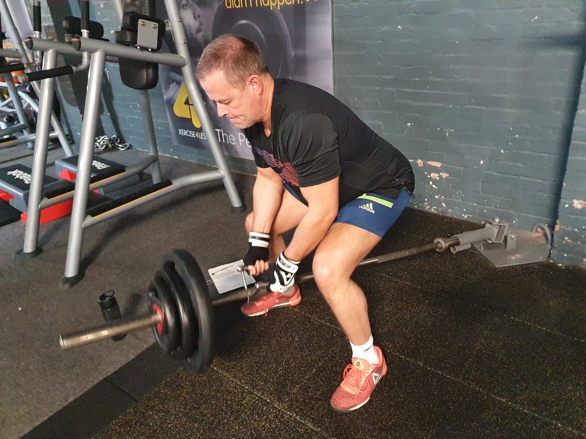 Client working through a barbell strength session